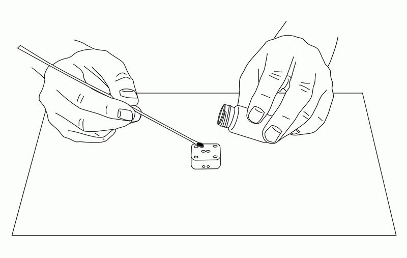 Fig. 6-7 Pile up carbon paste in the holes of the electrode with a spatula.