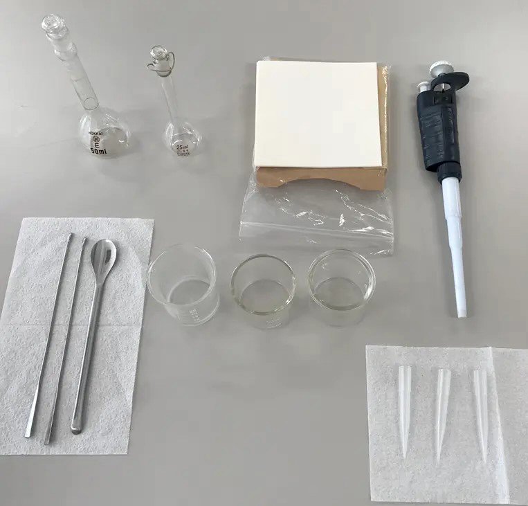 Fig. 1 What you need to prepare: 1. Volumetric flask;2. Spatula;3. Medicine wrapping paper;4. Beaker 50 mL;5. Pipette 1 mL;6. Glass rod;7. Light shielding bottle